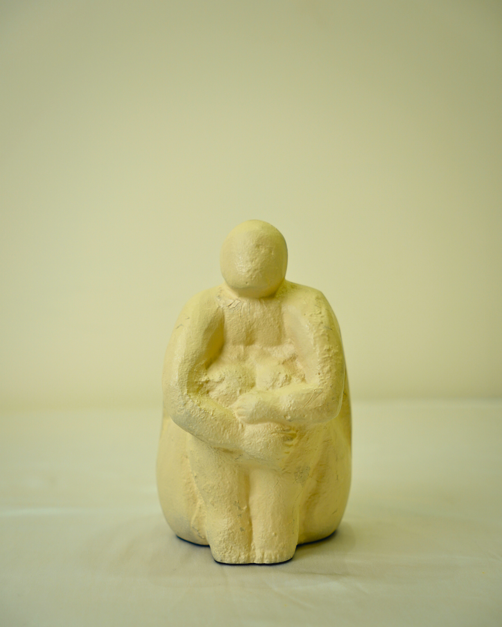 Abstract Seated Human Figurine