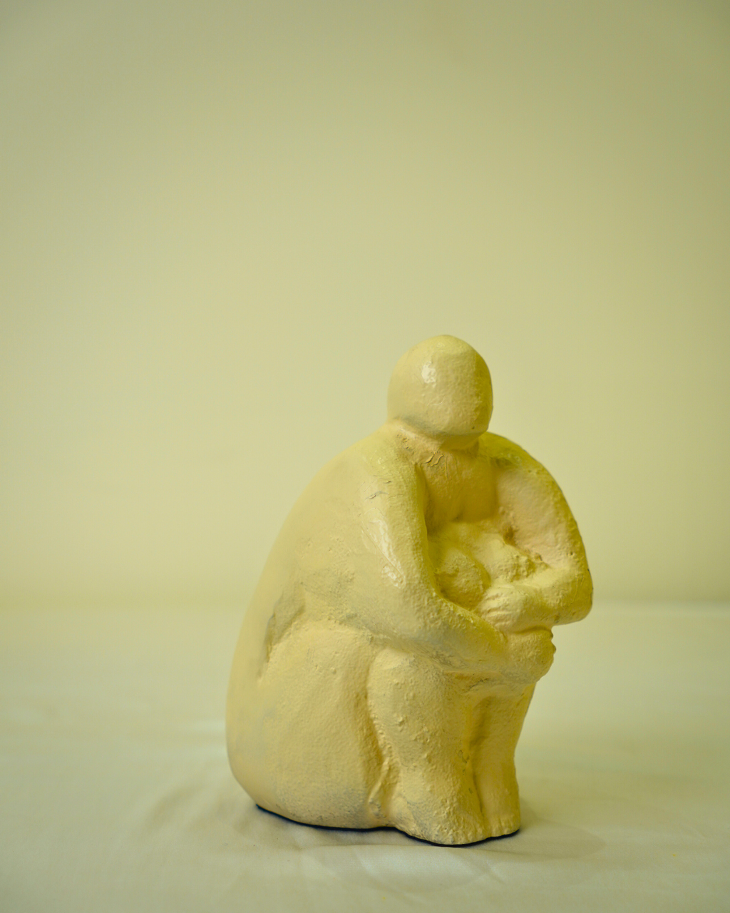 Abstract Seated Human Figurine