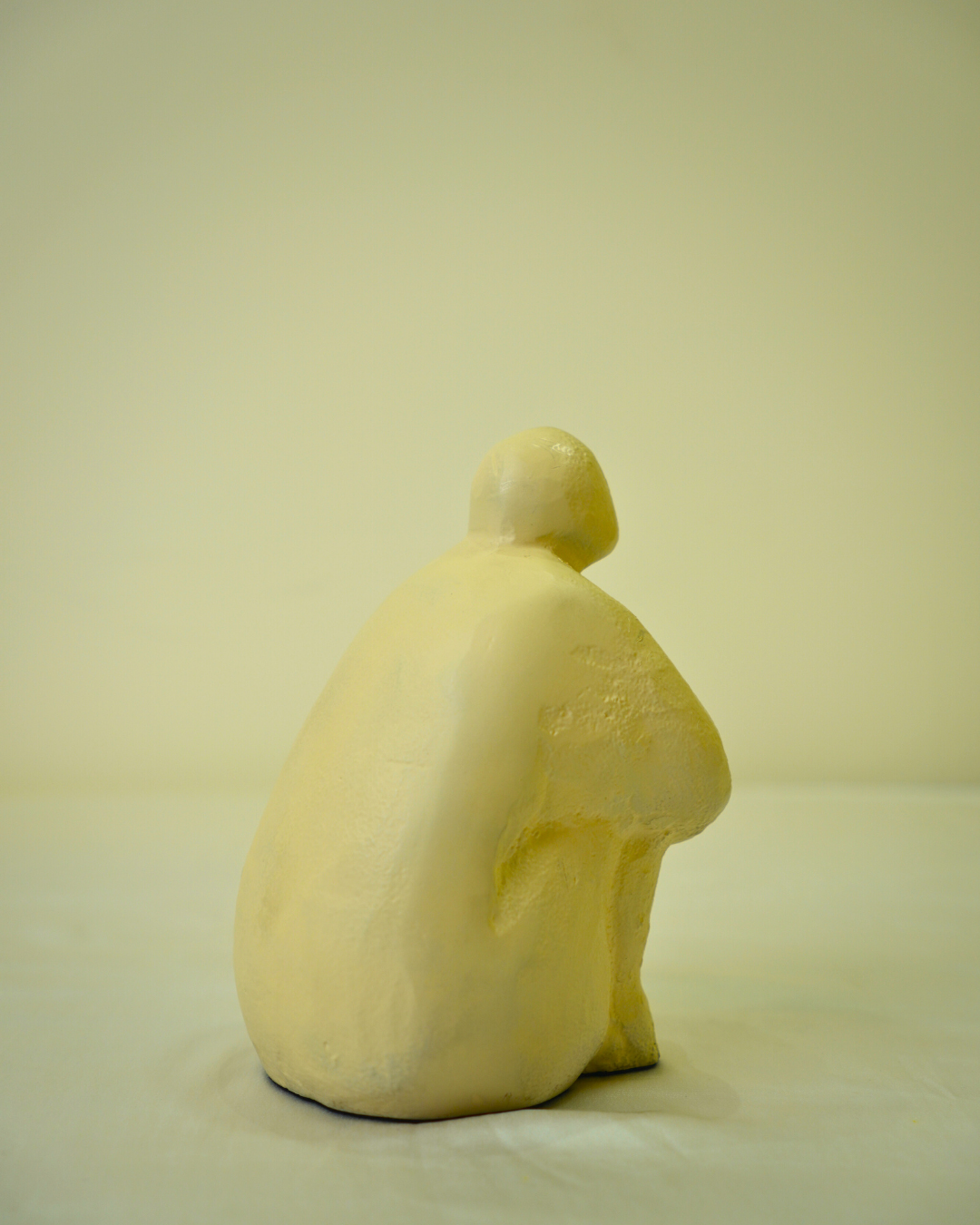 Abstract Seated Human Figurine