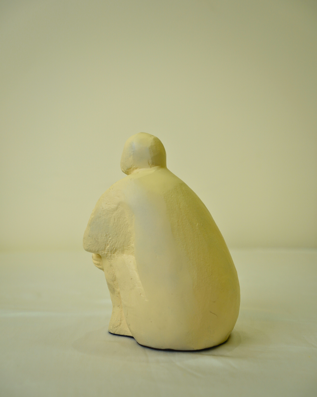 Abstract Seated Human Figurine