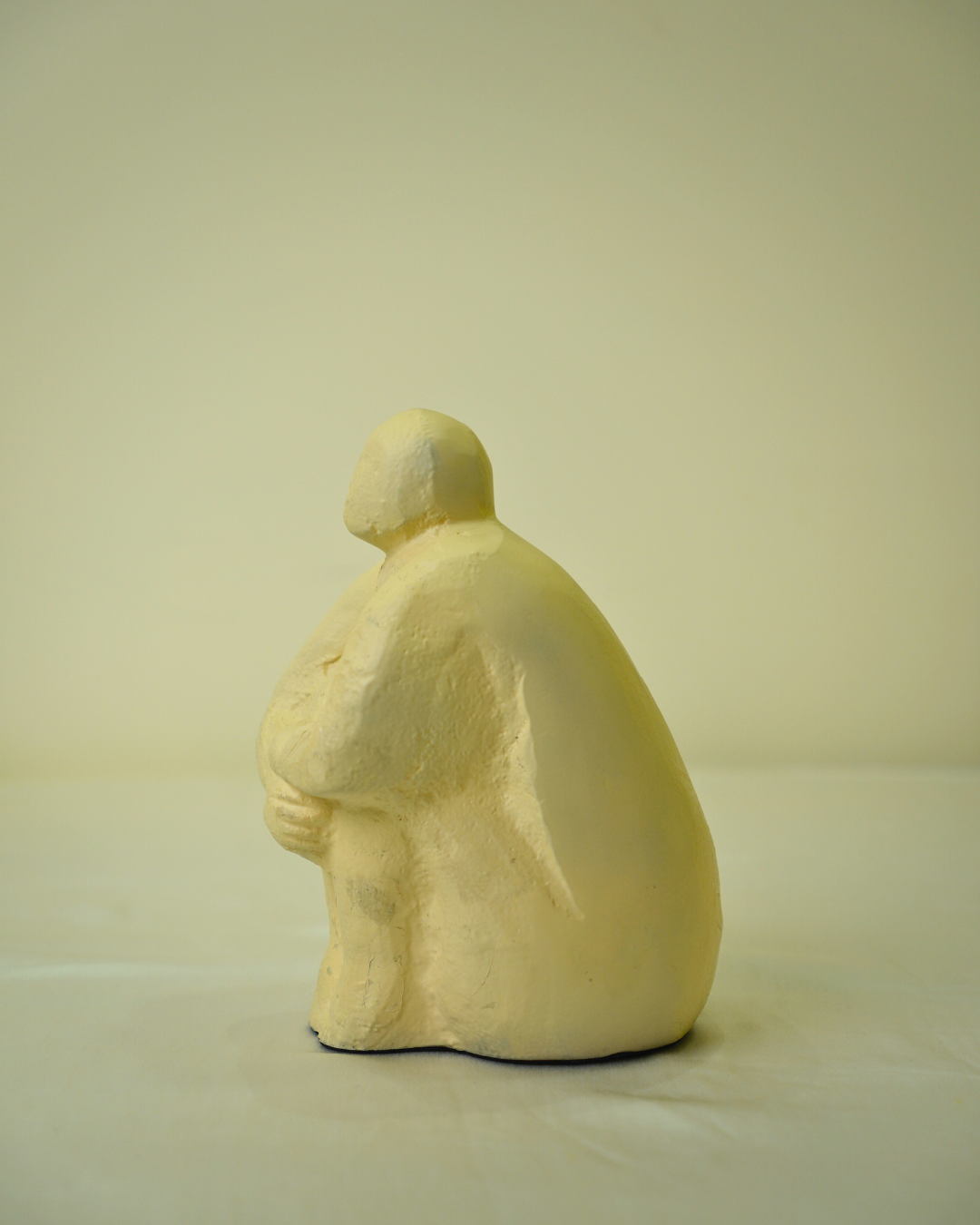 Abstract Seated Human Figurine