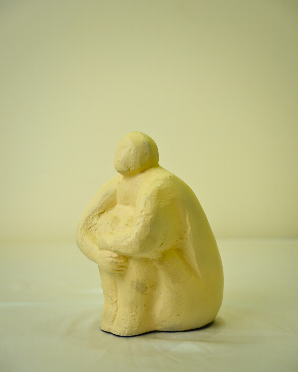 Abstract Seated Human Figurine