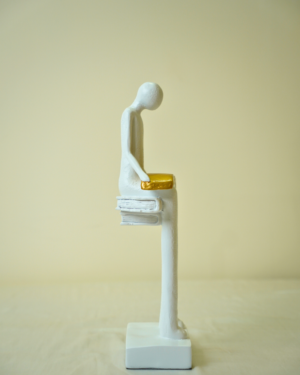 Liber White Reading Man Sculpture