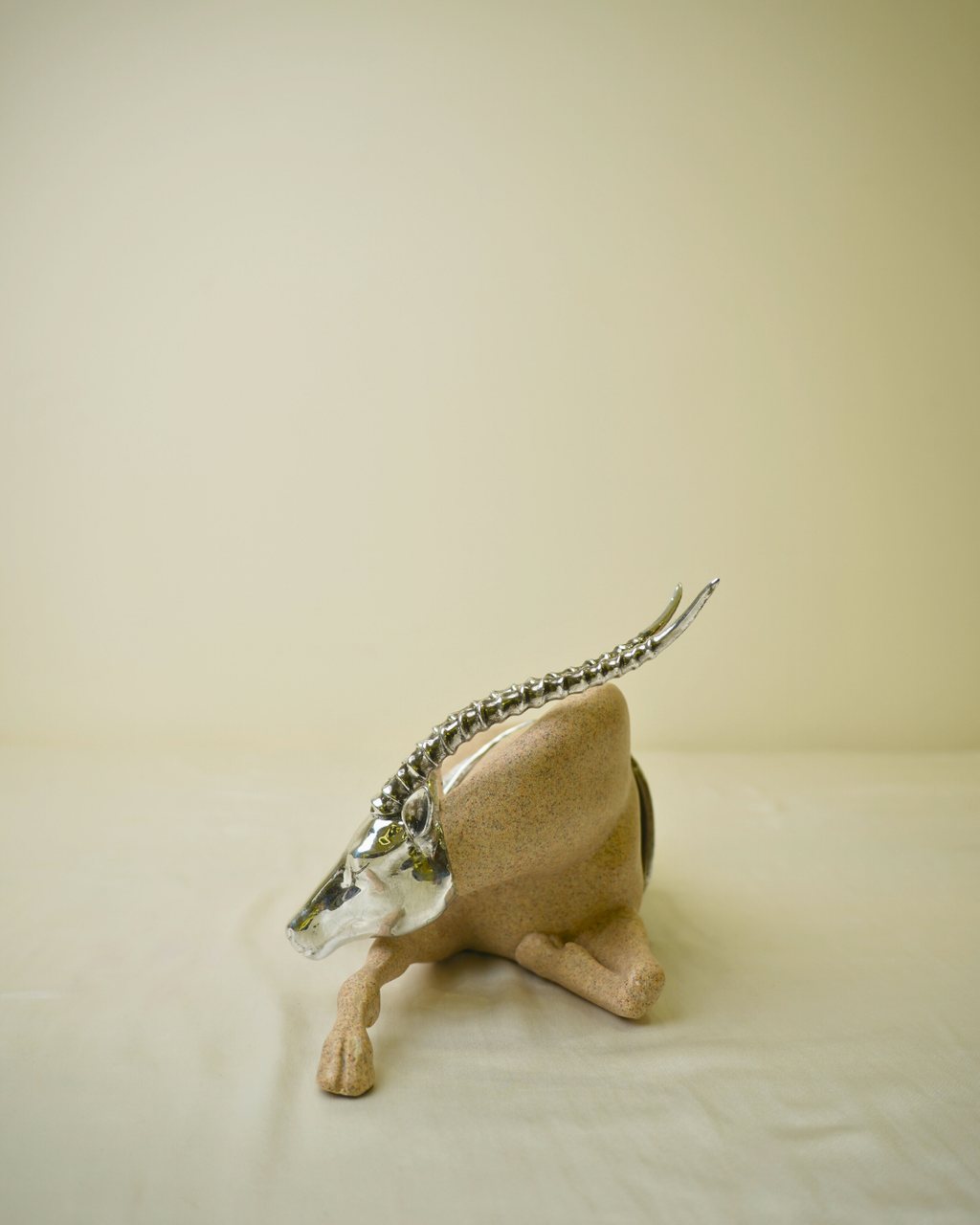 Graceful Desert Springbok - Reclining Antelope Figurine with Chrome Accents