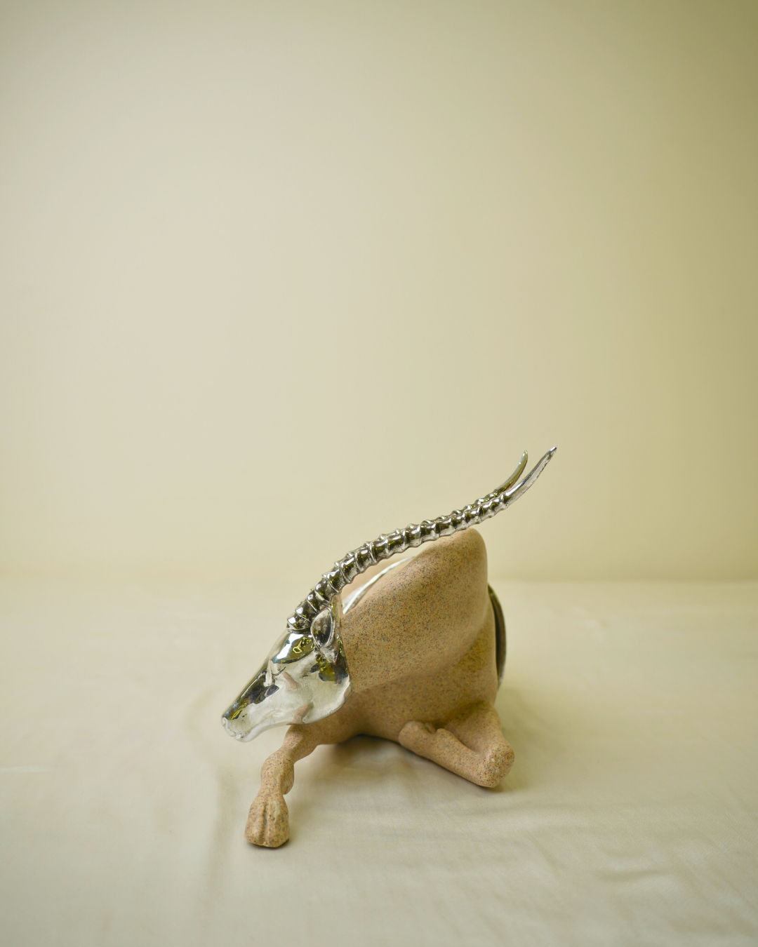 Graceful Desert Springbok - Reclining Antelope Figurine with Chrome Accents
