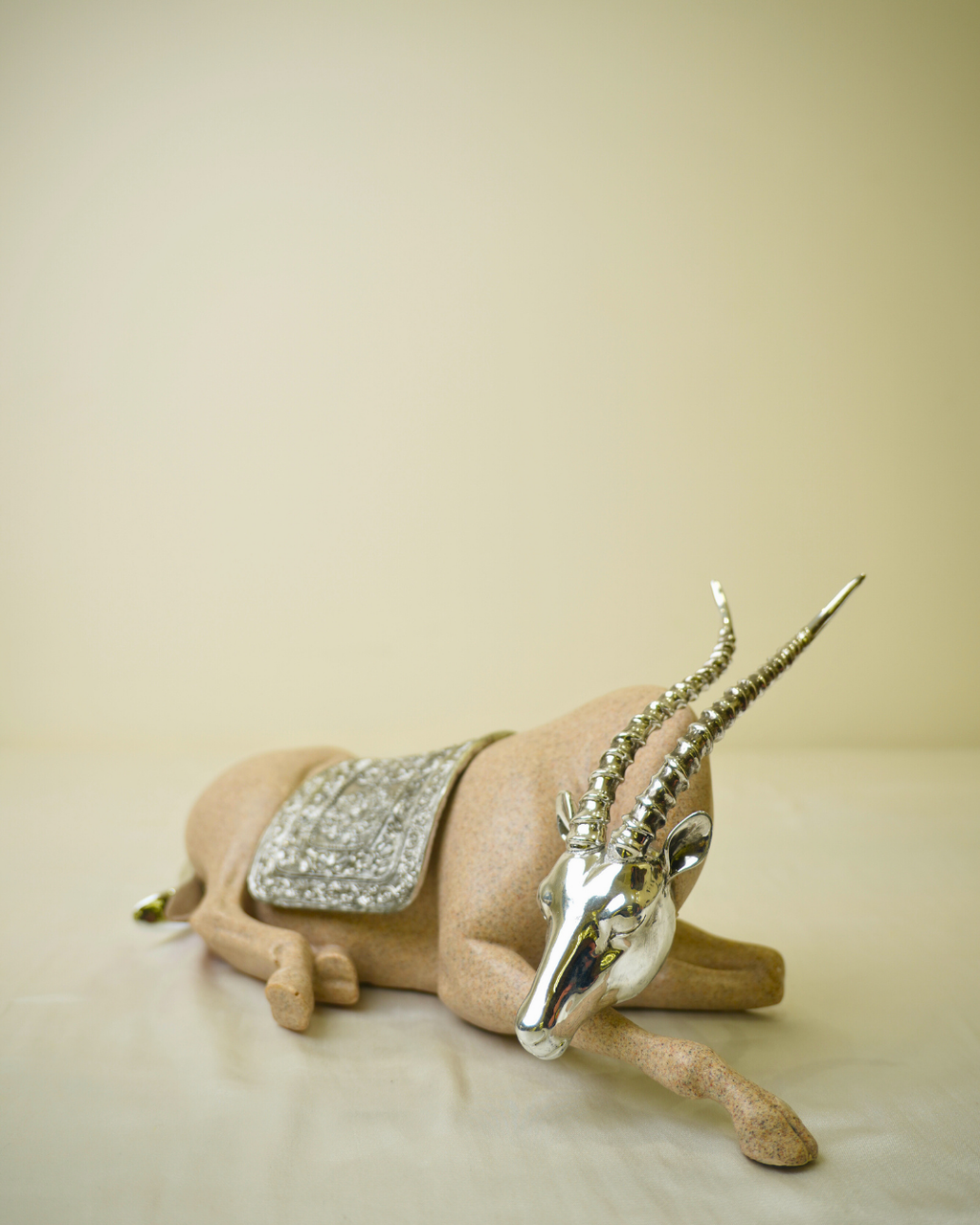 Graceful Desert Springbok - Reclining Antelope Figurine with Chrome Accents