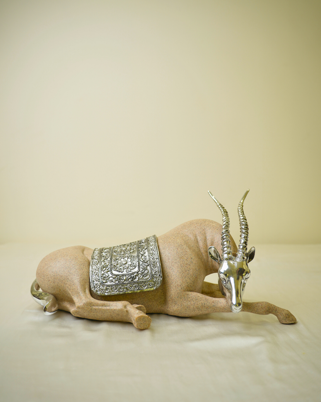 Graceful Desert Springbok - Reclining Antelope Figurine with Chrome Accents