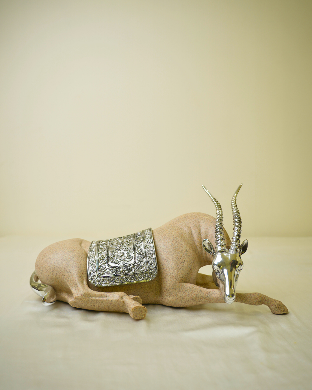 Graceful Desert Springbok - Reclining Antelope Figurine with Chrome Accents