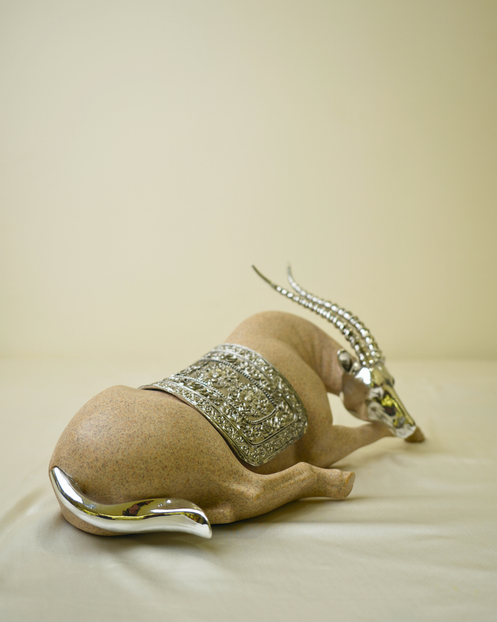 Graceful Desert Springbok - Reclining Antelope Figurine with Chrome Accents