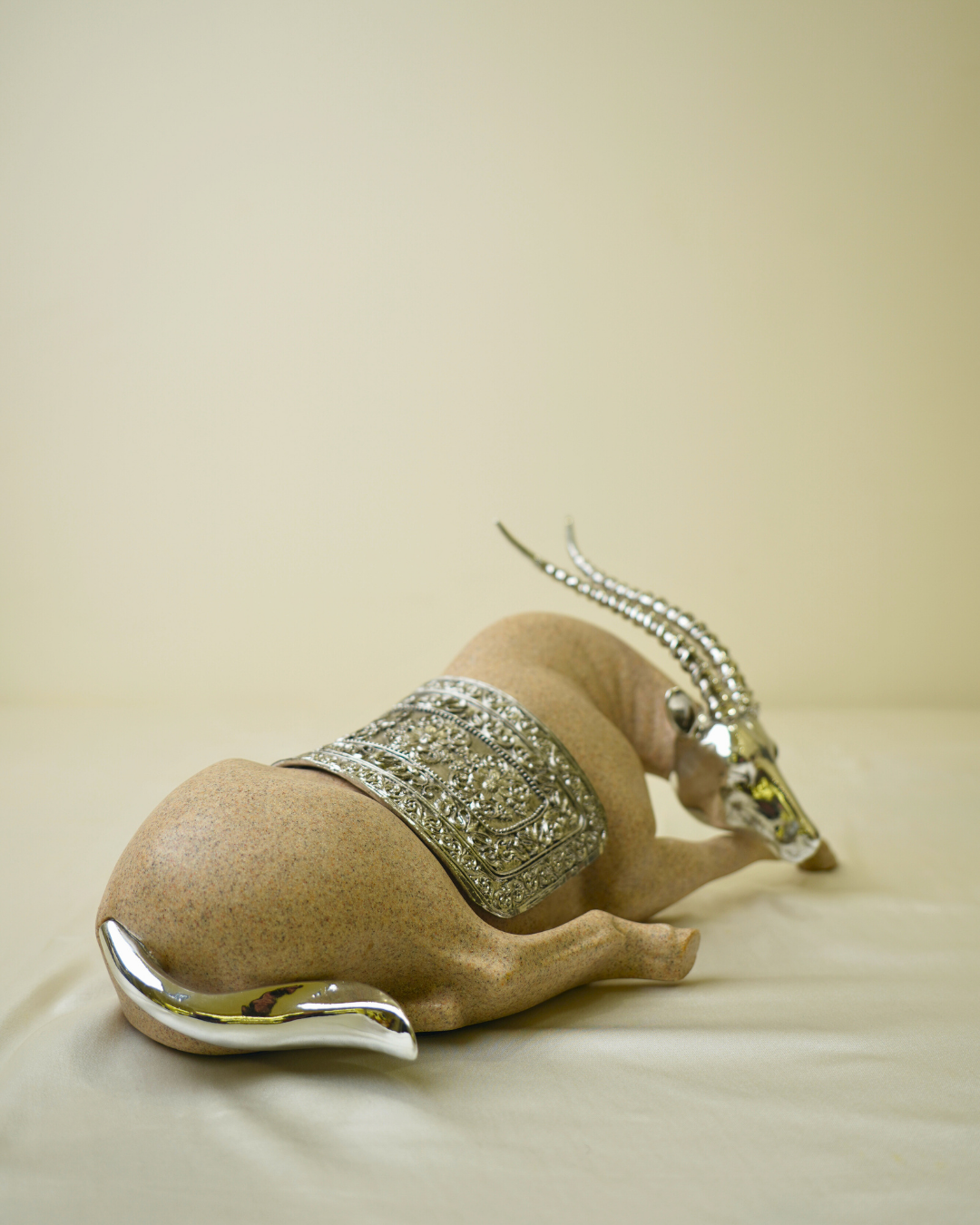 Graceful Desert Springbok - Reclining Antelope Figurine with Chrome Accents