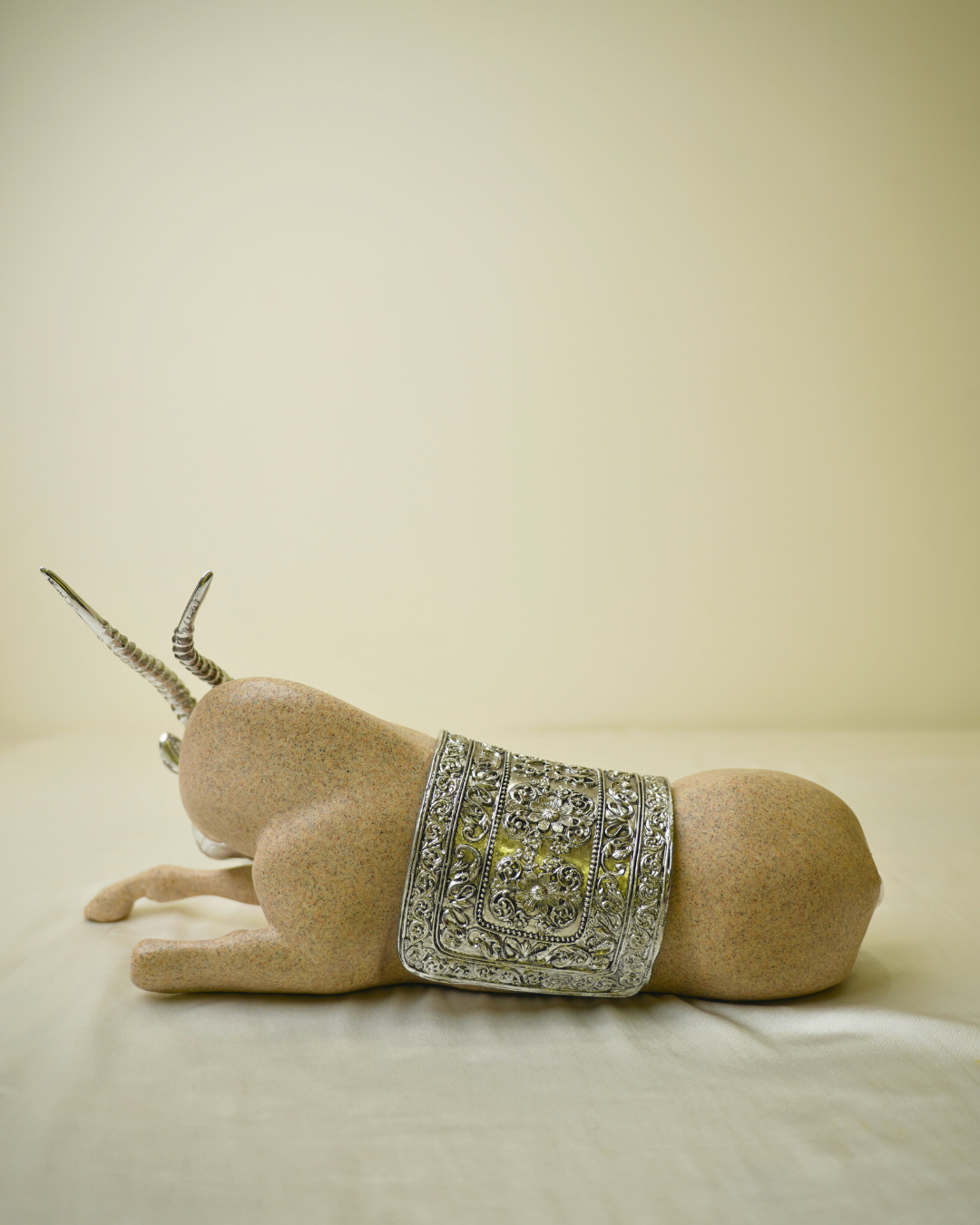 Graceful Desert Springbok - Reclining Antelope Figurine with Chrome Accents