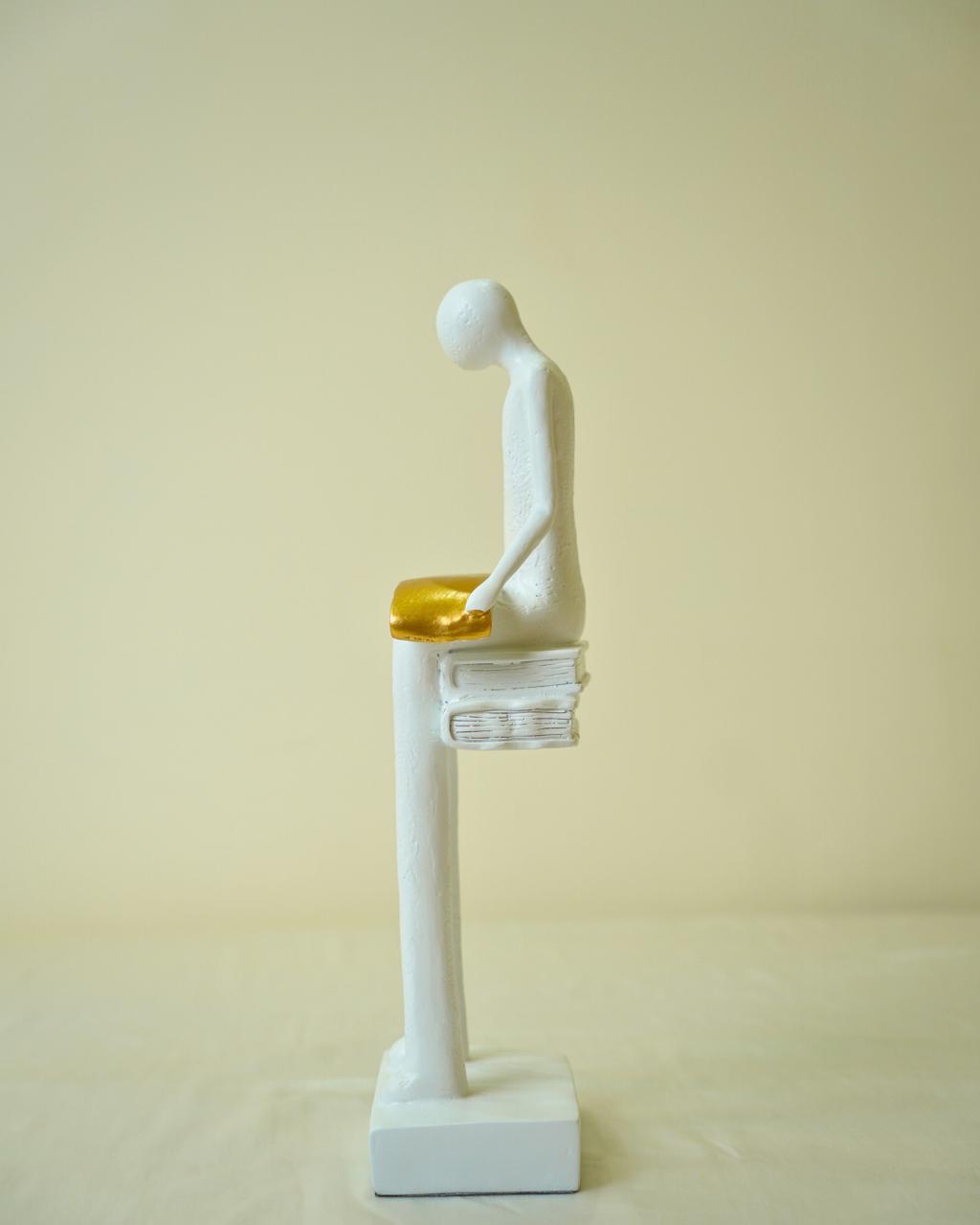 Liber White Reading Man Sculpture