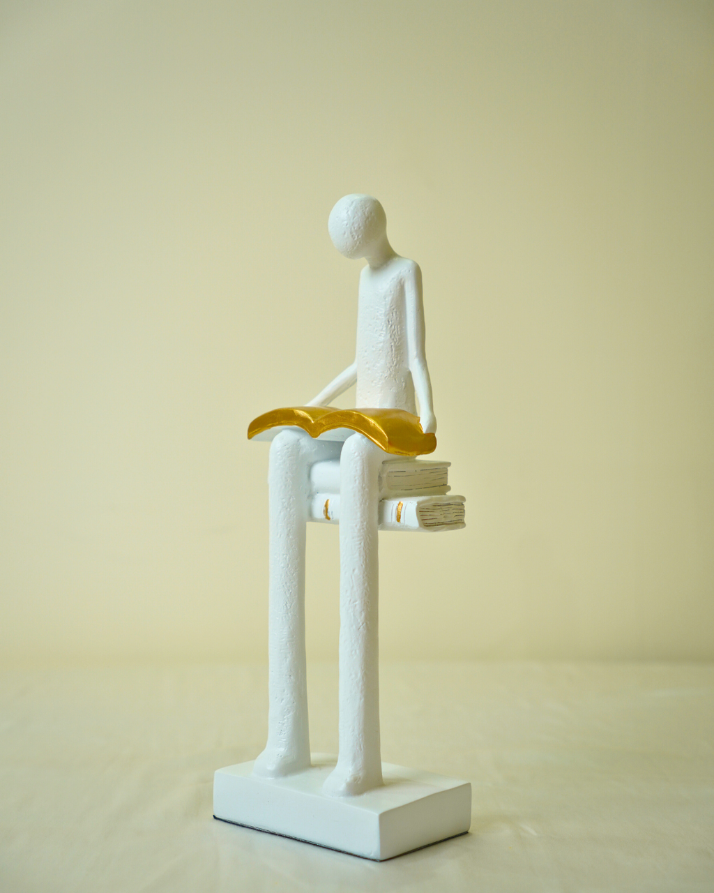 Liber White Reading Man Sculpture