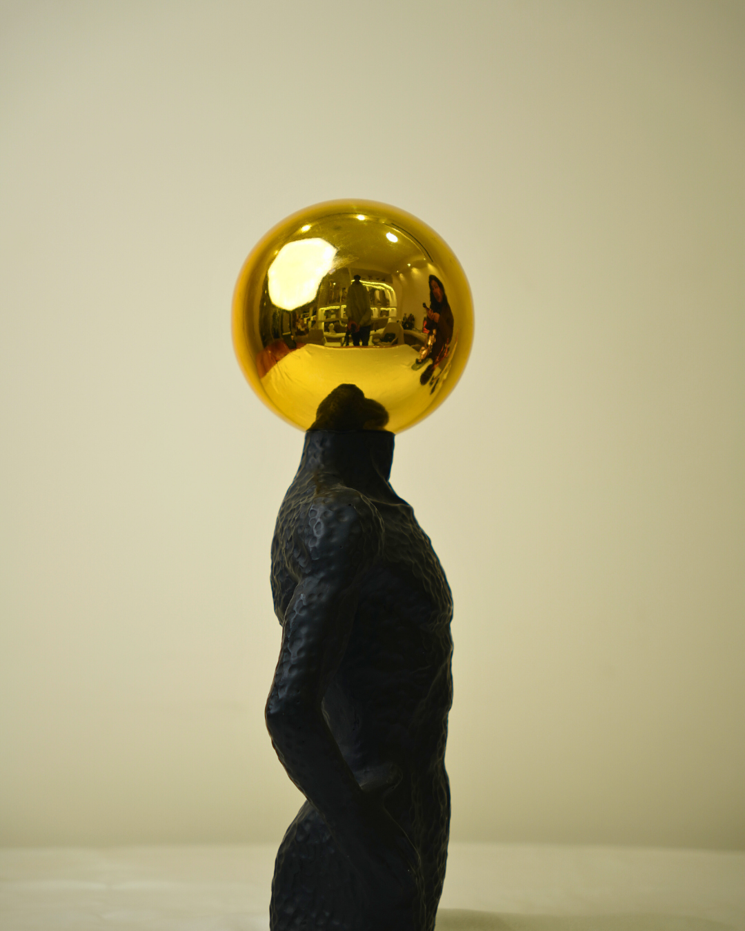 Modern Muscle Craft Accent - Surrealist Figurine with Golden Sphere