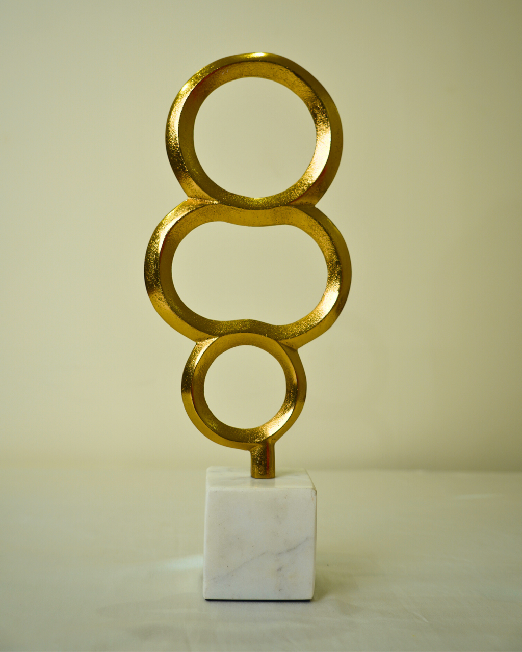 Abstract Golden Metal Triple Ring Sculpture with Marble Base