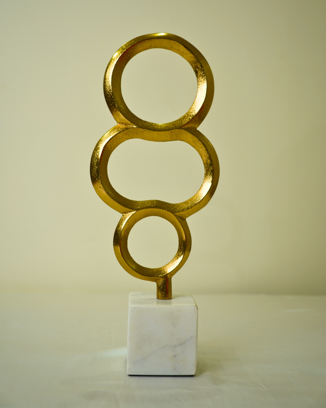 Abstract Golden Metal Triple Ring Sculpture with Marble Base