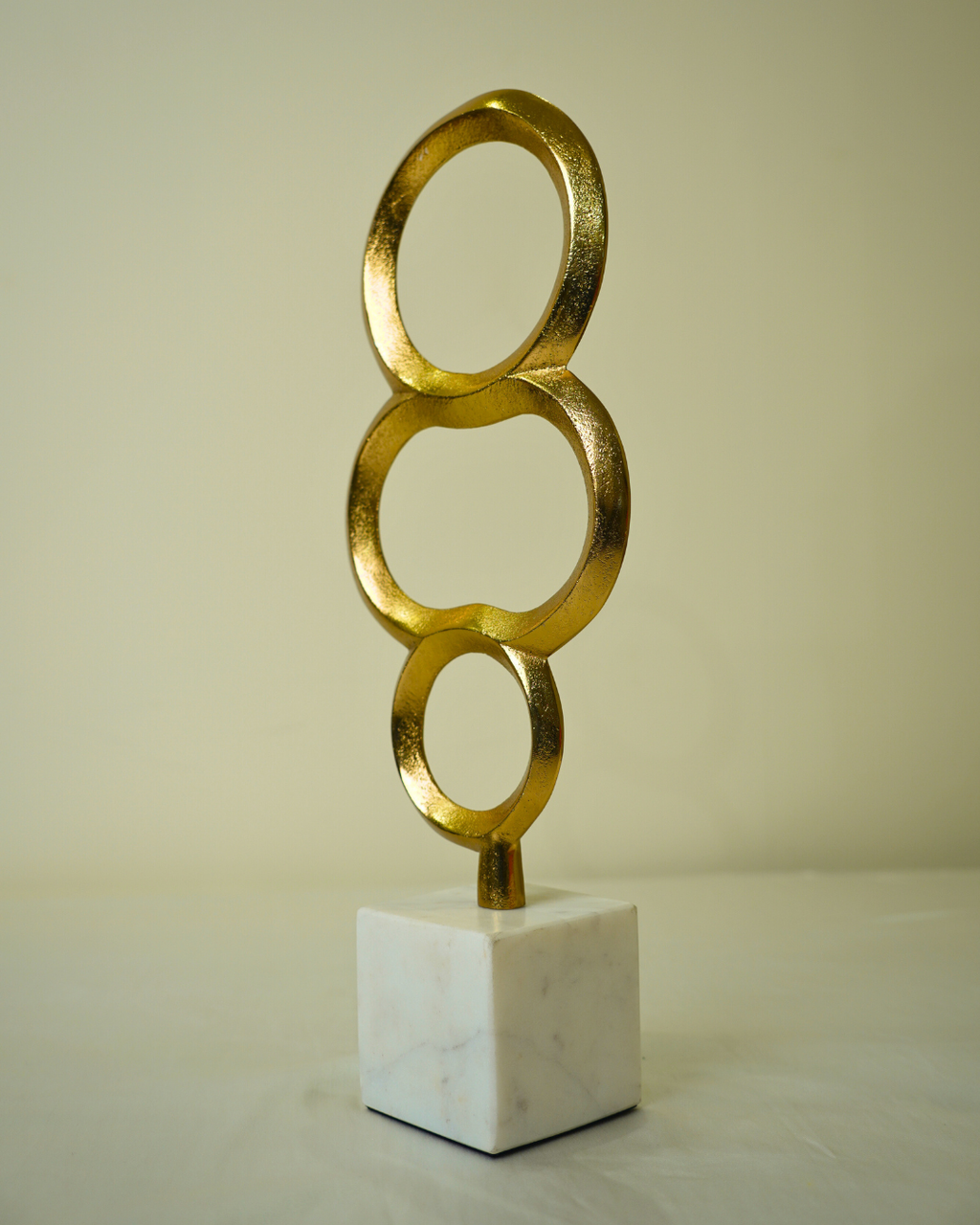 Abstract Golden Metal Triple Ring Sculpture with Marble Base