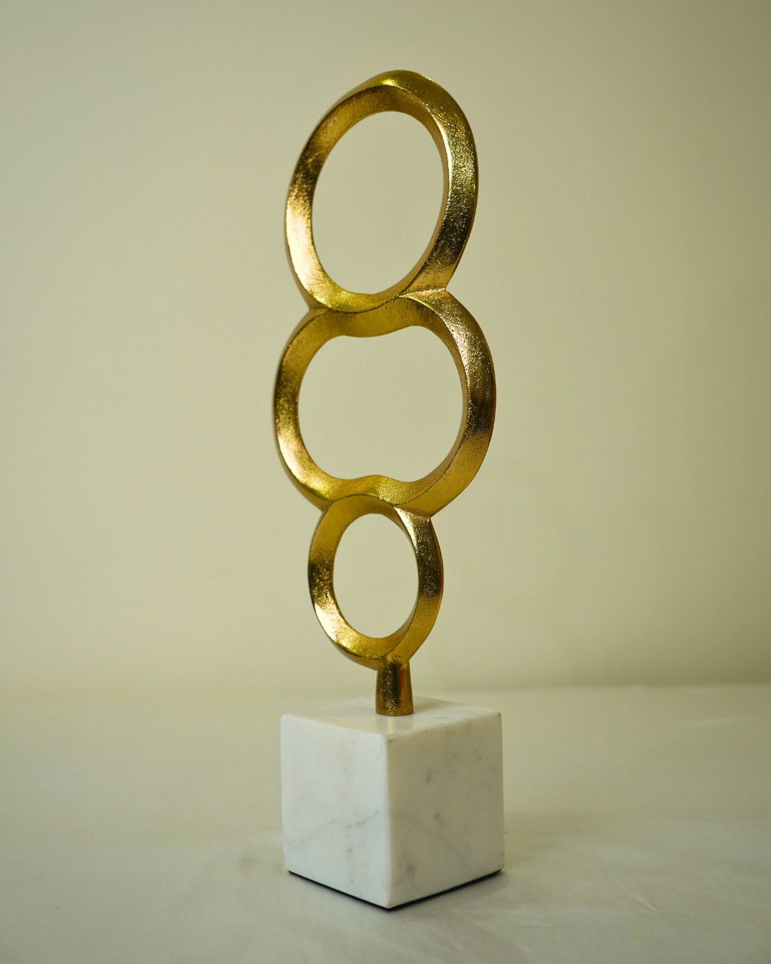 Abstract Golden Metal Triple Ring Sculpture with Marble Base