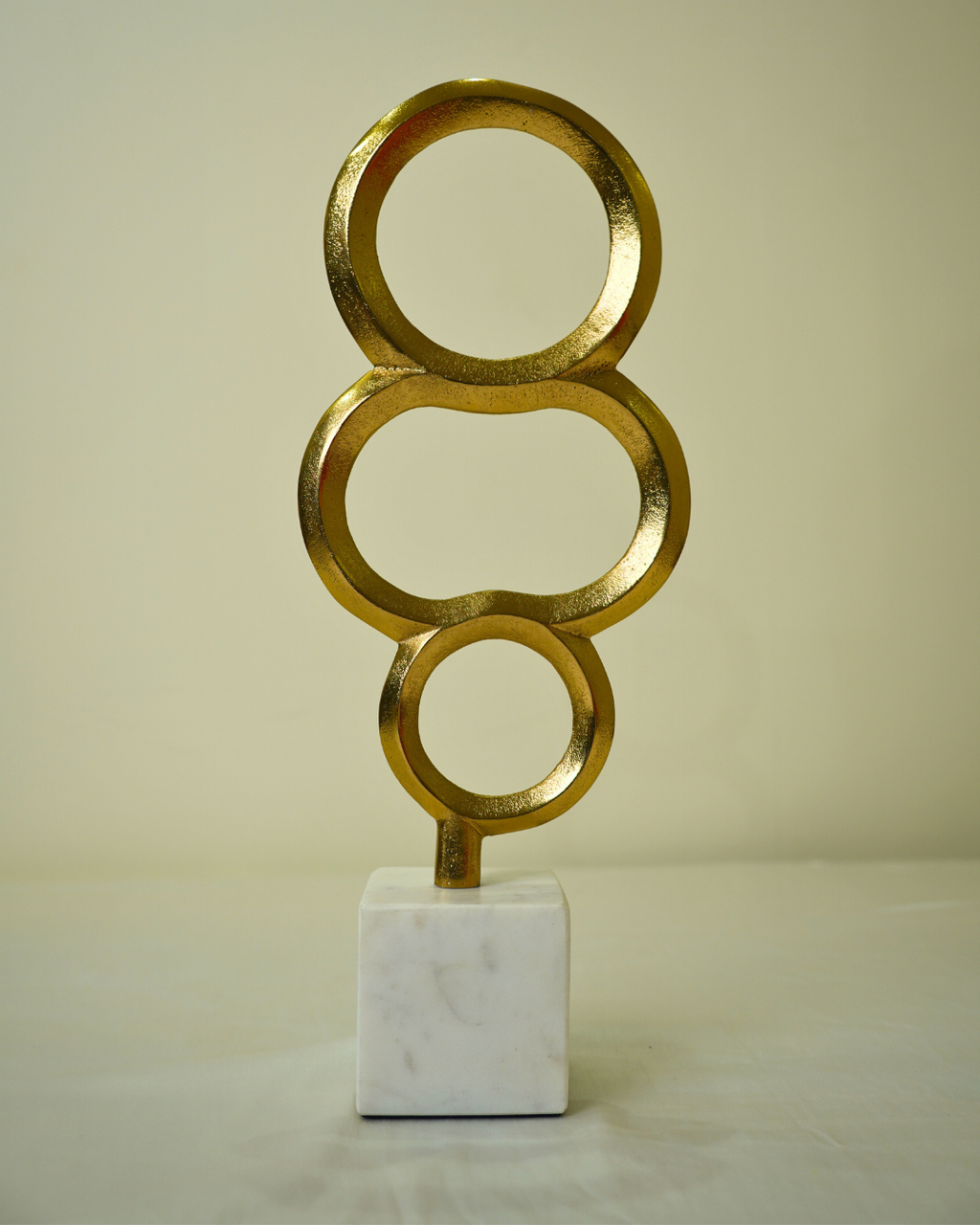 Abstract Golden Metal Triple Ring Sculpture with Marble Base