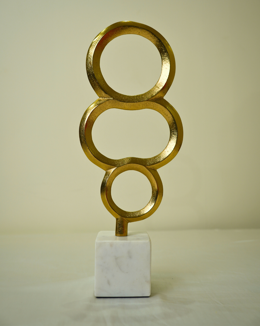 Abstract Golden Metal Triple Ring Sculpture with Marble Base