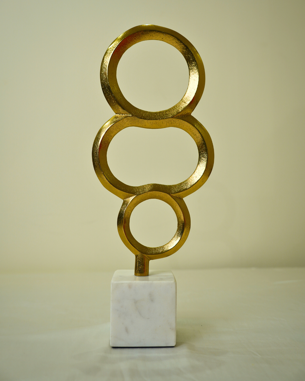 Abstract Golden Metal Triple Ring Sculpture with Marble Base